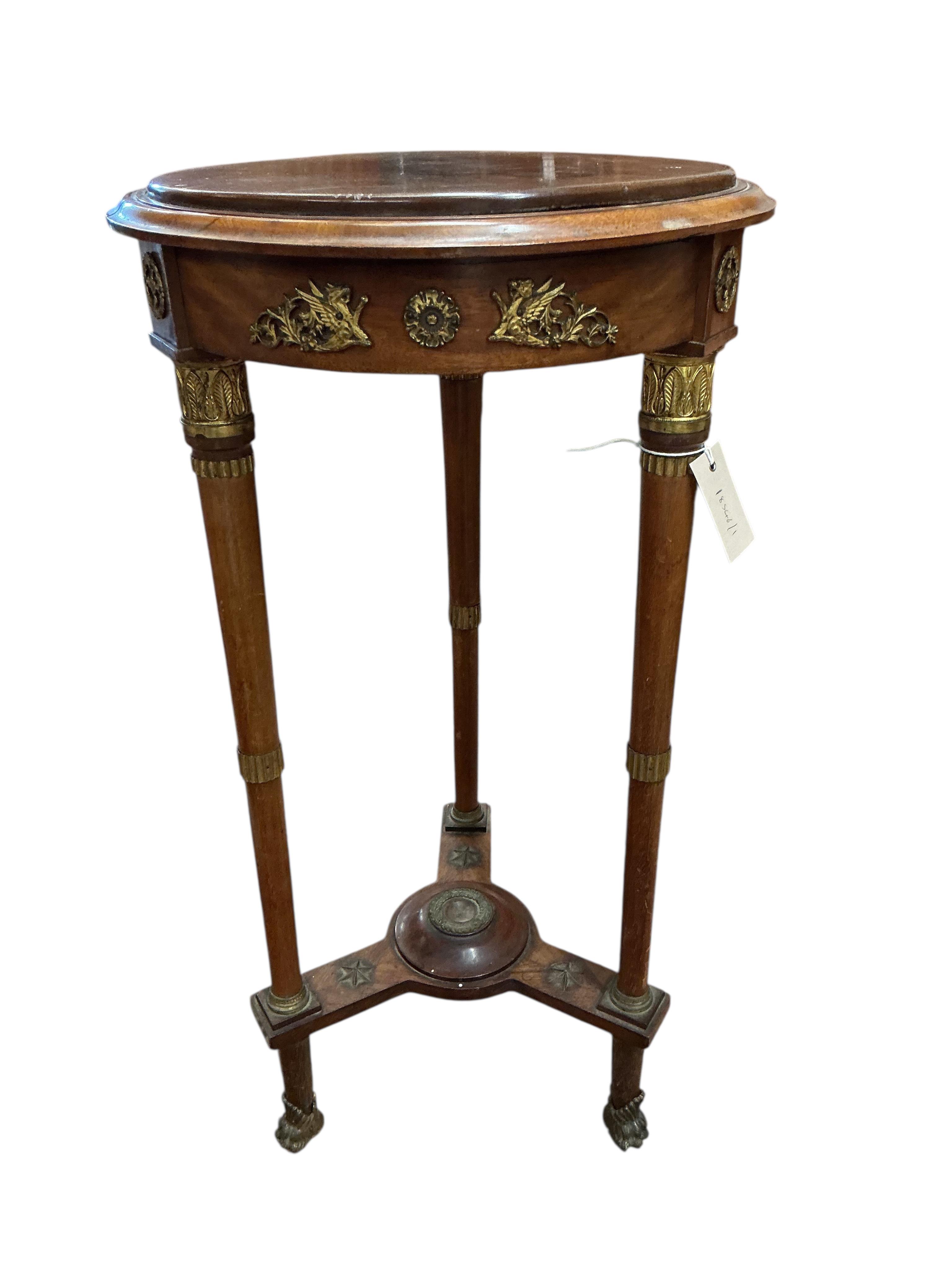 An empire style gilt metal mounted mahogany gueridon table